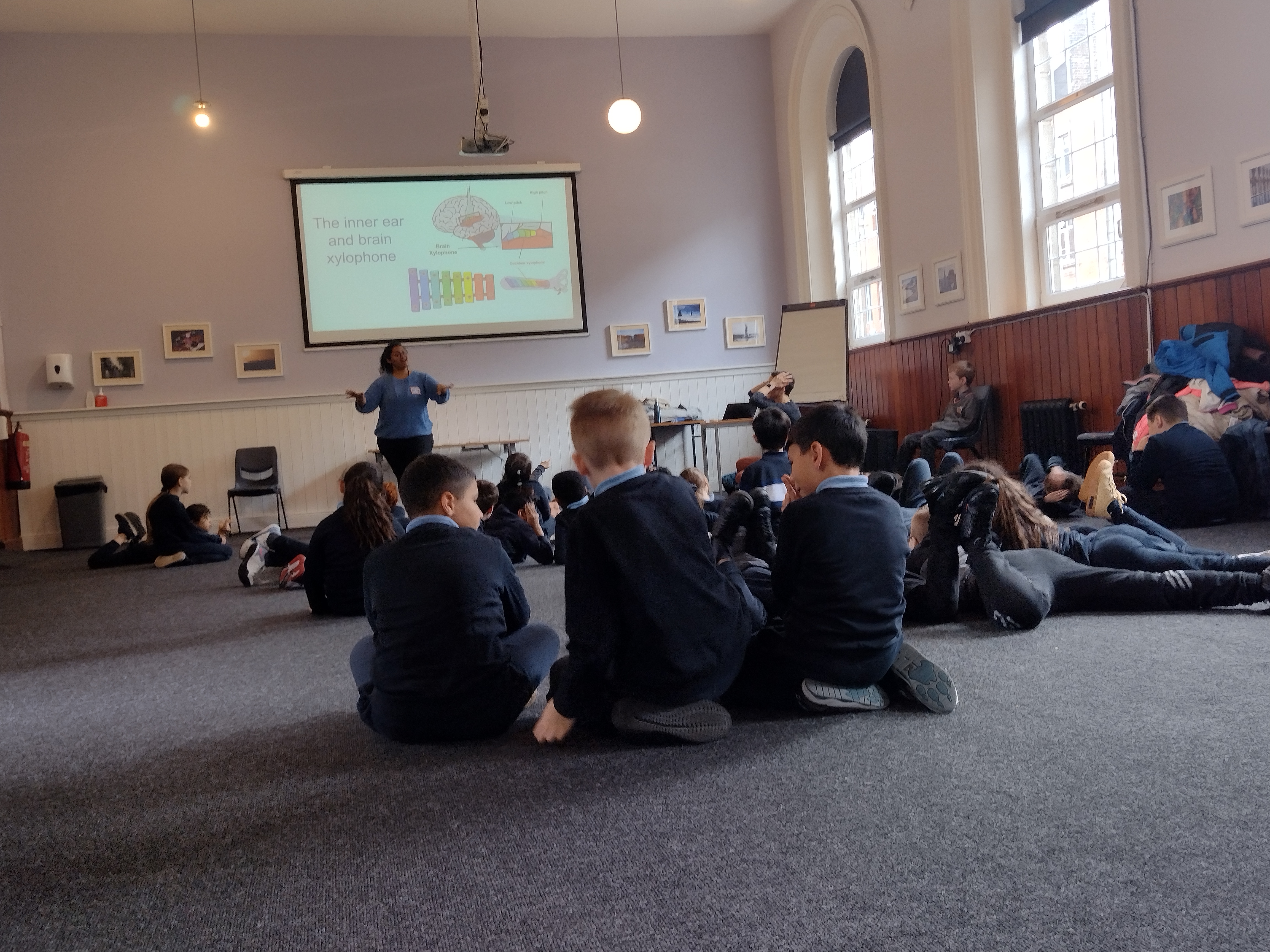 Anusha in a classroom leading a Brain FM session